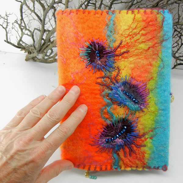 Hand dyed, hand felted journal cover with journal included.
